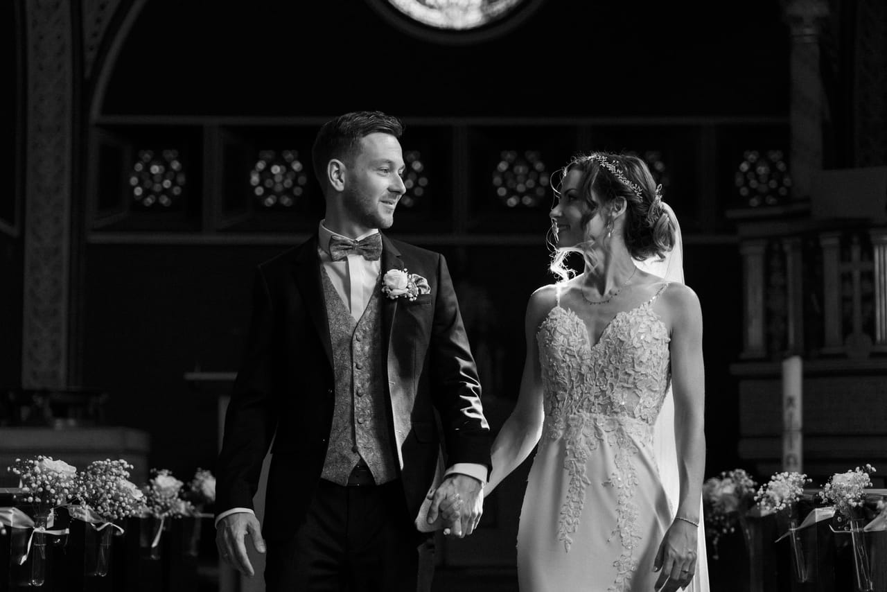 Wedding couple walking together, black and white